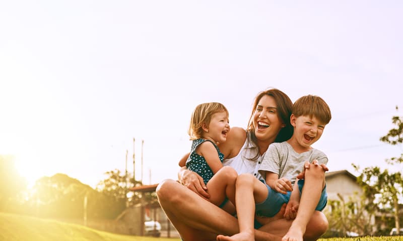 Image of a mother playing with two children